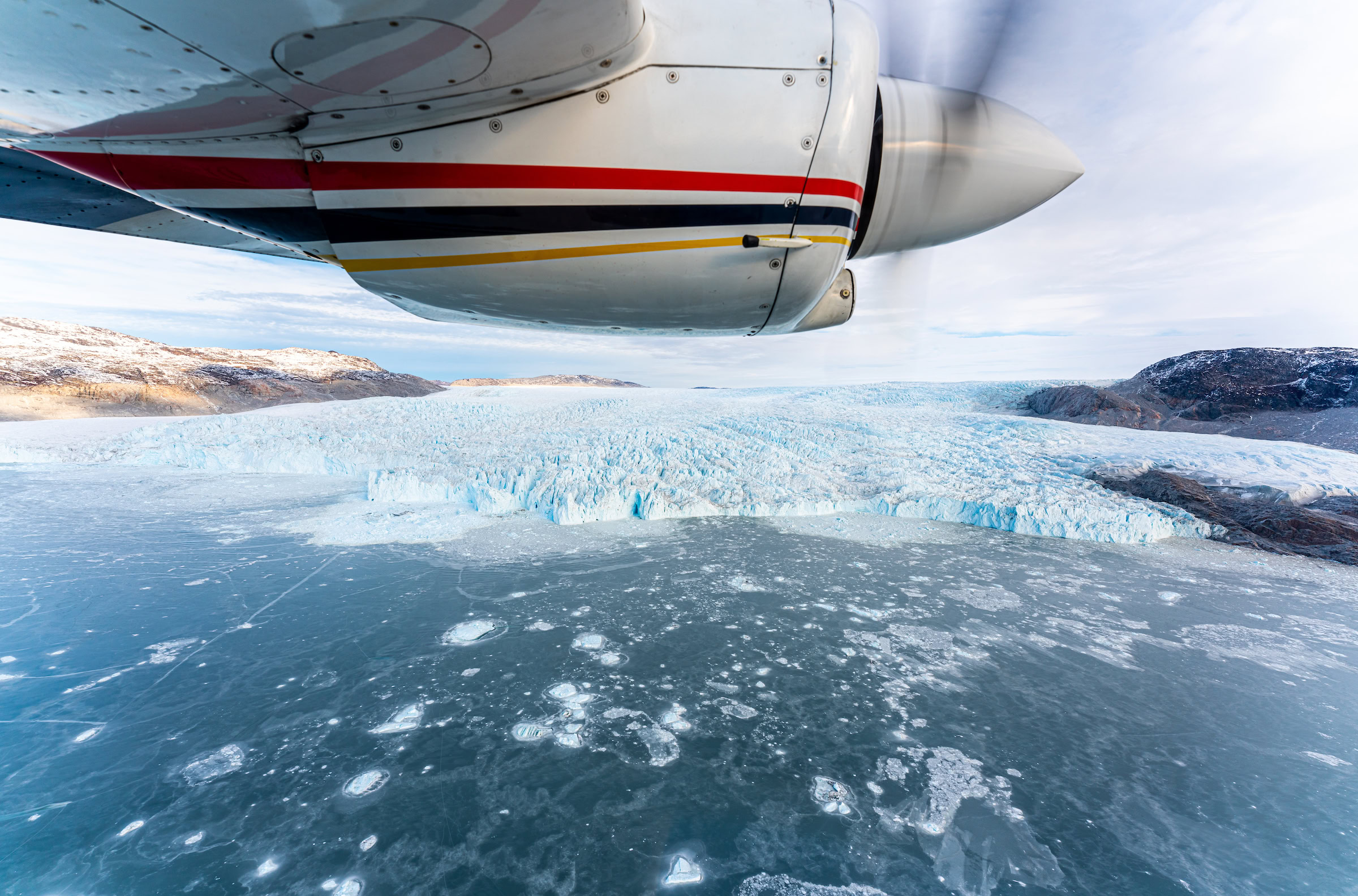 A must is to explorer glaciers and fjords from above with AirZafari in Greenland. Photo by Henrik Møller Nielsen - Visit Greenland