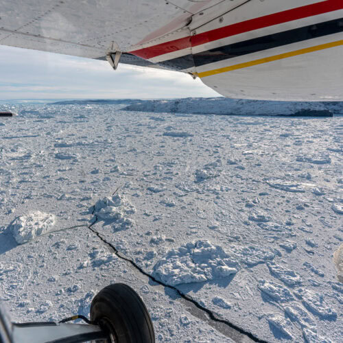 Flying over Icebergs in the Icefjord with AirZafari in Ilulissat. Photo by Henrik Møller Nielsen - Visit Greenland