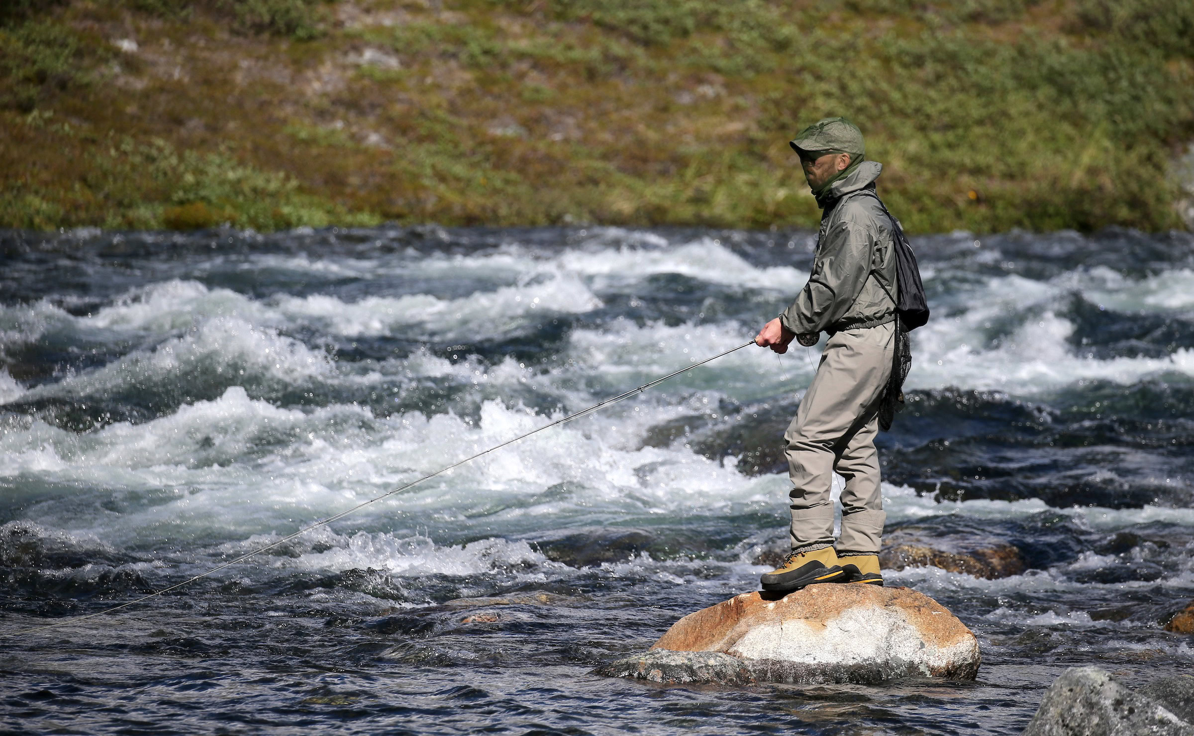 Flyfisherman enjoying the solitude of Maniitsoq