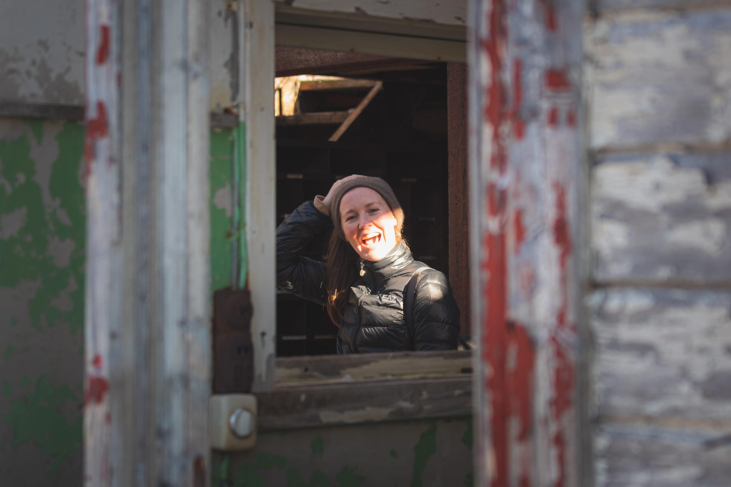 millenial-woman-smiling-in-abandoned-house