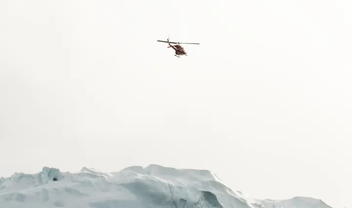 Air-Greenland-Chopper-Above-Iceberg