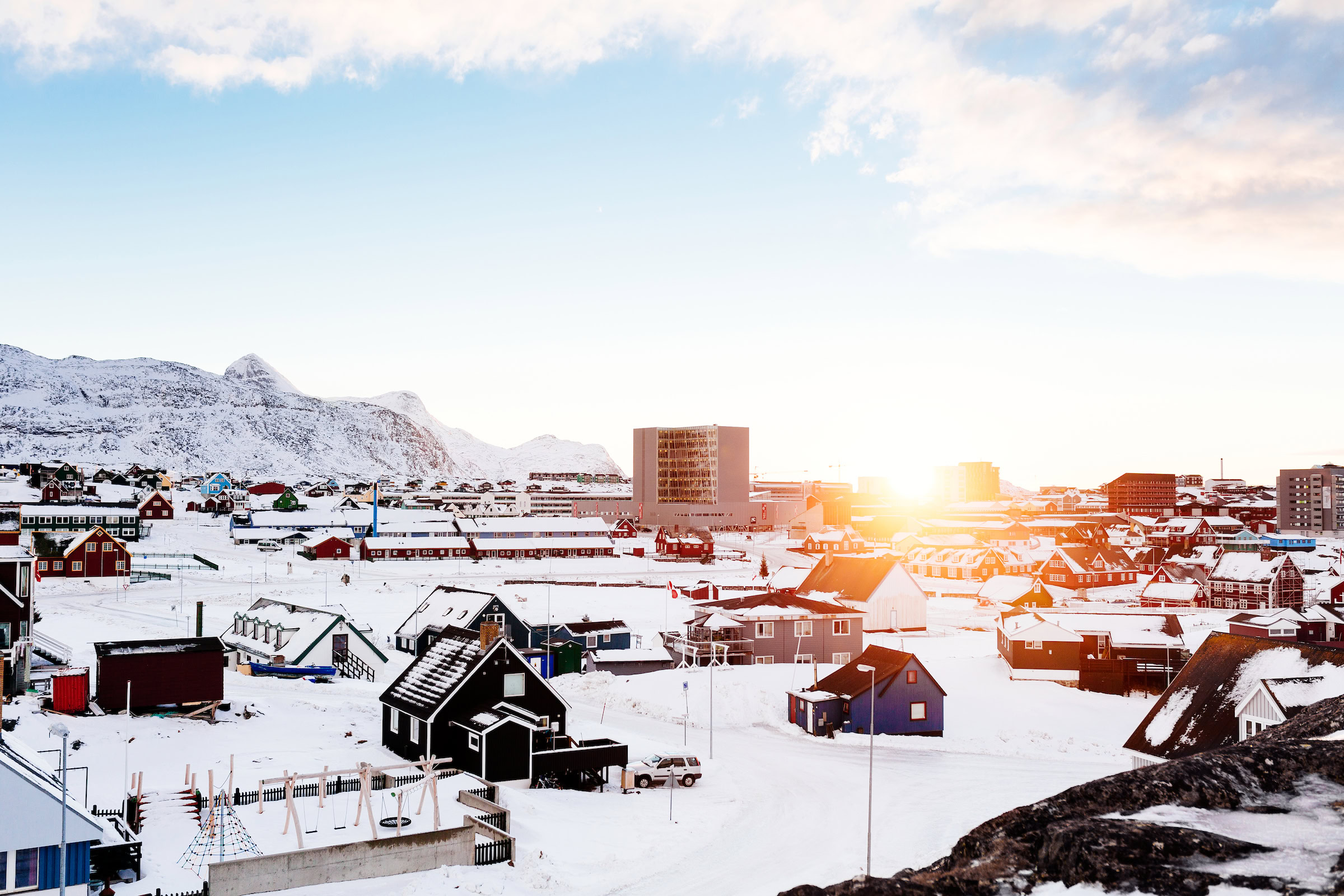 Sunrise over a snowcovered Nuuk in Greenland. Photo by Rebecca Gustafsson - Visit Greenland